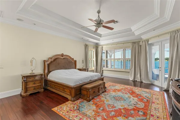 a bathroom with double vanity sinks a toilet a shower and a mirror