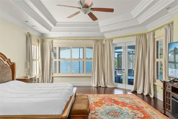 a living room with furniture and a ceiling fan