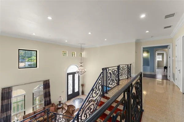 a front view of residential houses with yard and trees