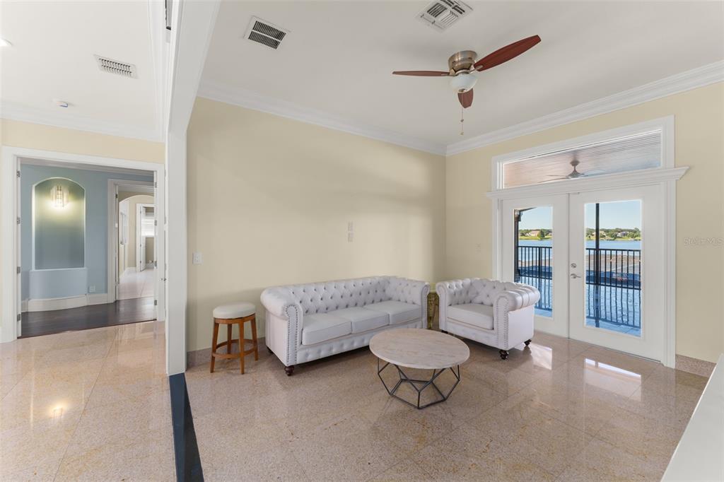9575 Westover Roberts Road Windermere, FL 34786 - Photo 48 of 95 a living room with furniture and a ceiling fan