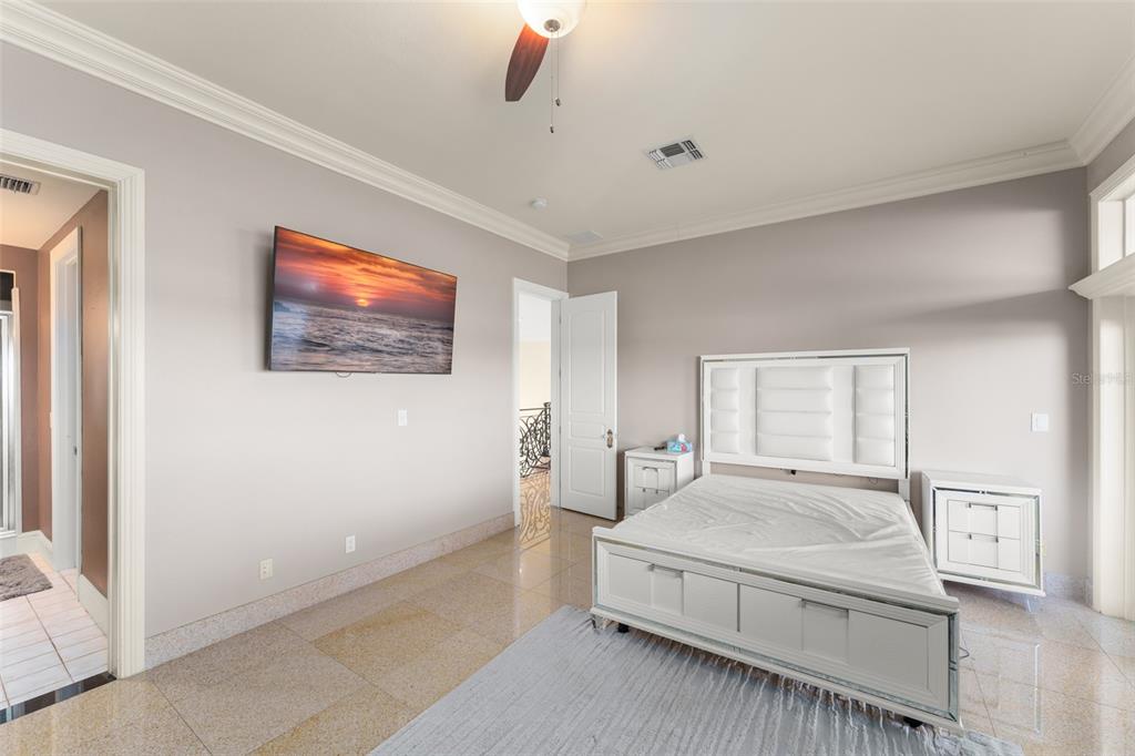 9575 Westover Roberts Road Windermere, FL 34786 - Photo 51 of 95 a bedroom with a bed and a painting on the wall