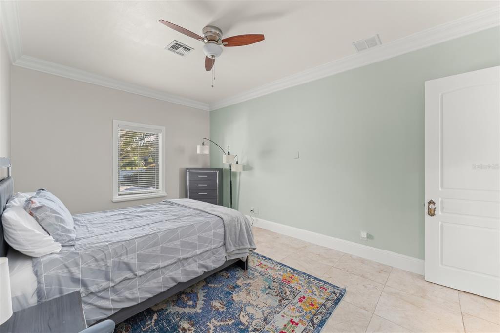 9575 Westover Roberts Road Windermere, FL 34786 - Photo 53 of 95 a bedroom with a bed and a window