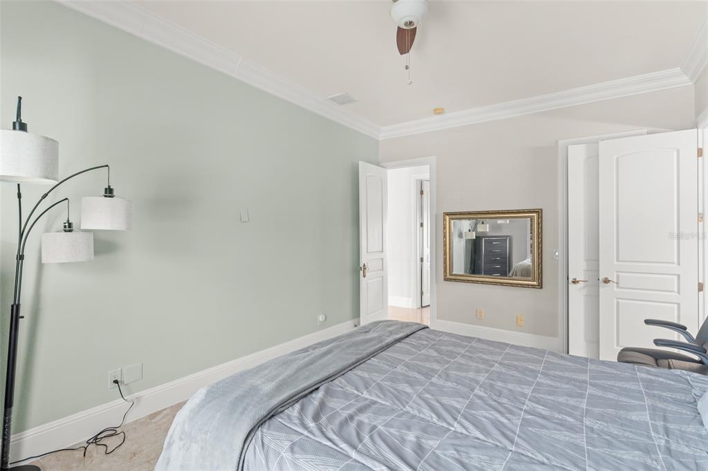 9575 Westover Roberts Road Windermere, FL 34786 - Photo 54 of 95 a bedroom with a bed and a window