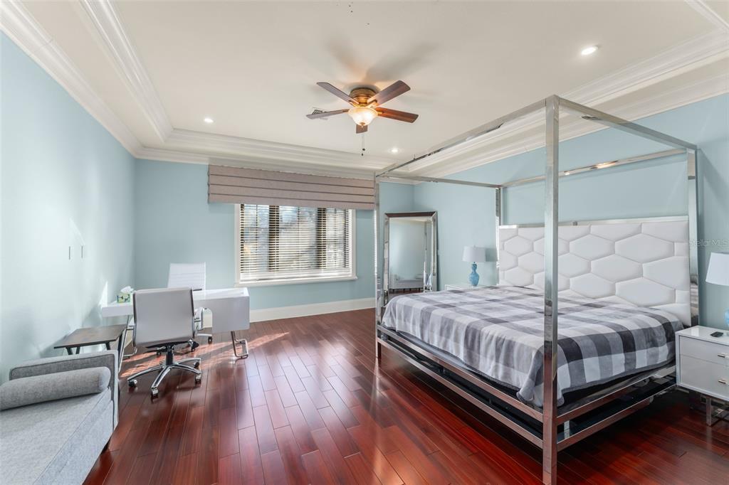 9575 Westover Roberts Road Windermere, FL 34786 - Photo 55 of 95 a bedroom with a bed and wooden floor