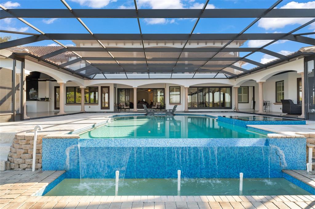 9575 Westover Roberts Road Windermere, FL 34786 - Photo 75 of 95 a view of a house with a swimming pool