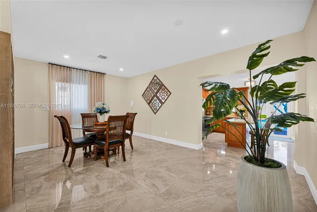 a bedroom with a bed and a dresser with mirror