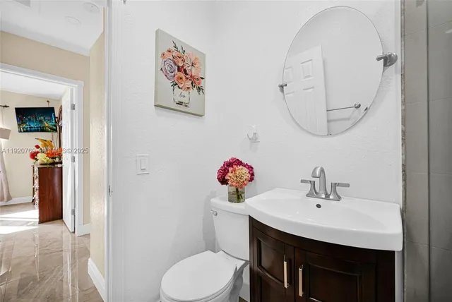 a view of a swimming pool with red chairs