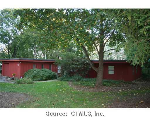561 Gilbert Avenue Hamden, CT 06514 - Photo 1 of 1 a view of a backyard with potted plants and large trees