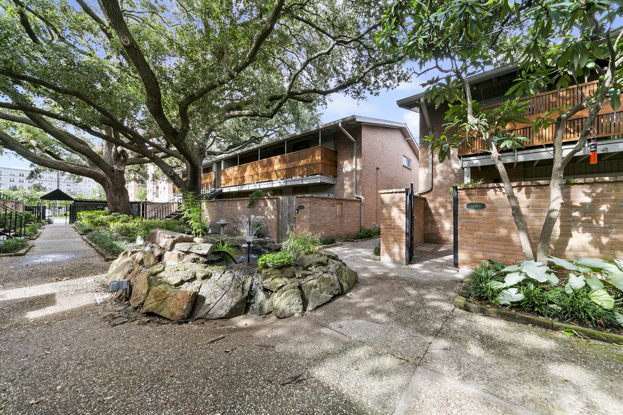 a view of backyard of house with outdoor seating and green space