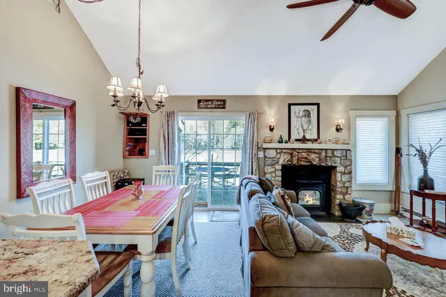 a kitchen with stainless steel appliances granite countertop a sink a stove and a wooden cabinets