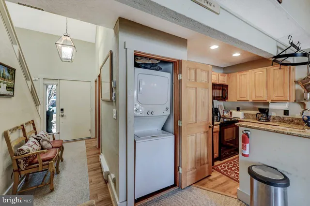 a view of an entryway with wooden floor