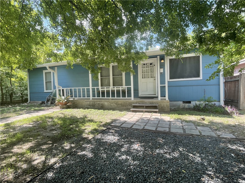 1041 Rosemont Street Austin, TX 78723 - Photo 1 of 13 front view of a house with a yard