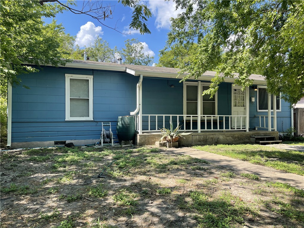 1041 Rosemont Street Austin, TX 78723 - Photo 13 of 13 a view of a house with a yard