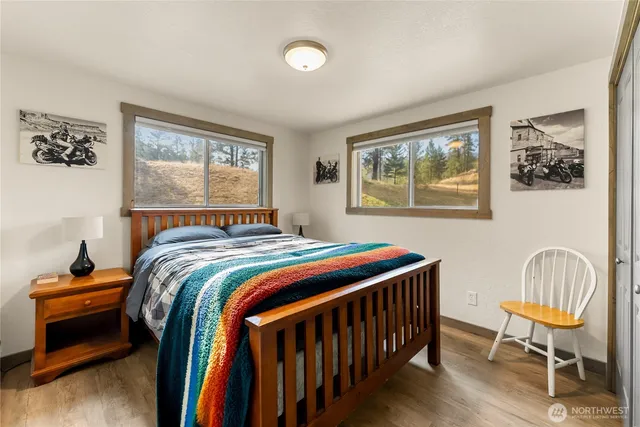 a bedroom with bed and window