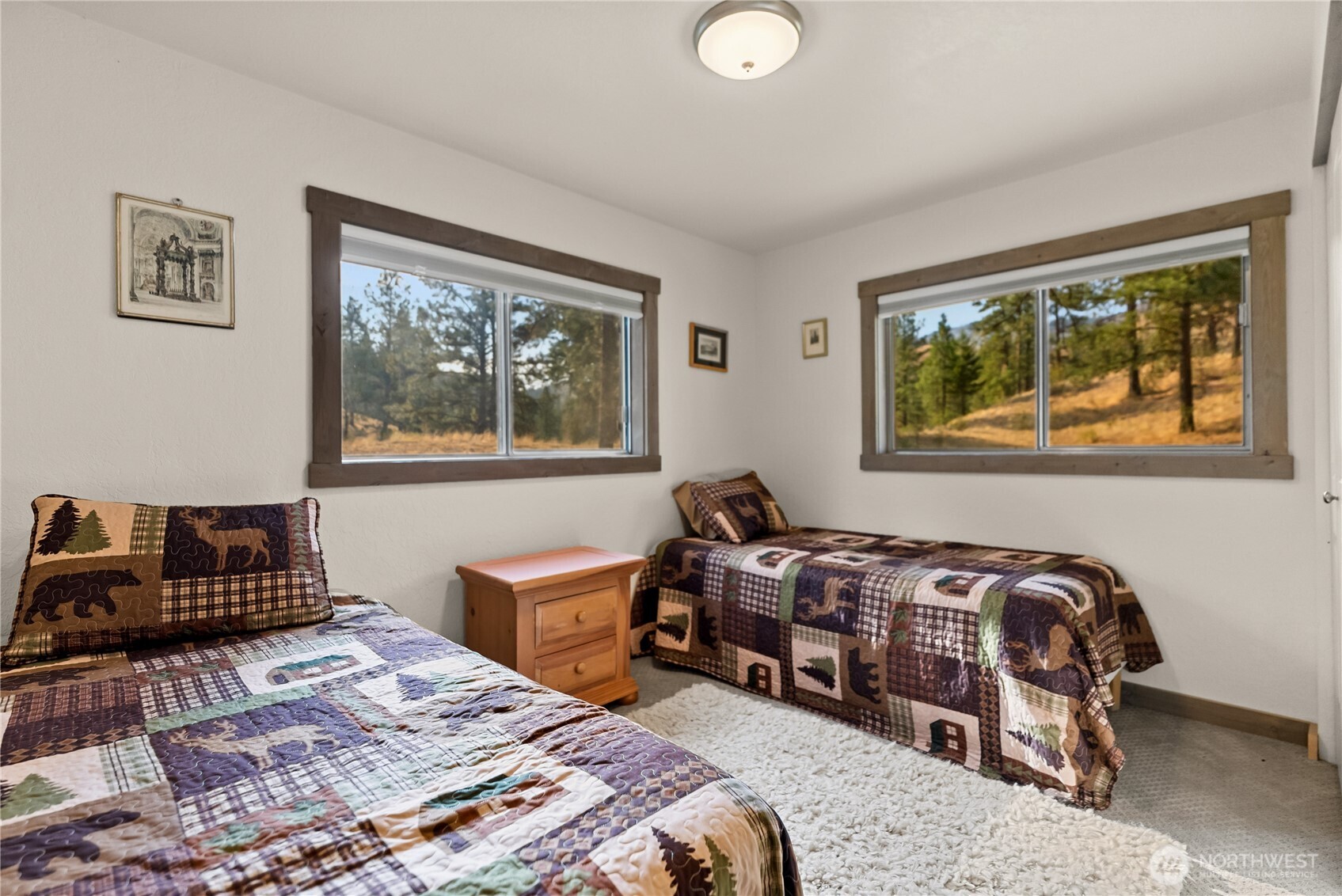 1425 Salmon Creek Road Okanogan, WA 98840 - Photo 29 of 39 a bedroom with bed and wooden floor