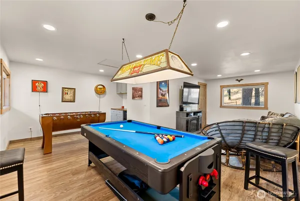 a view of a house with swimming pool next to a yard