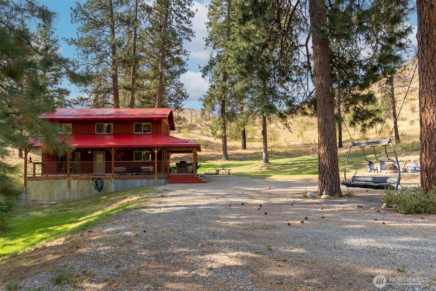 1425 Salmon Creek Road Okanogan, WA 98840 - Photo 36 of 39 a view of a house with swimming pool next to a yard