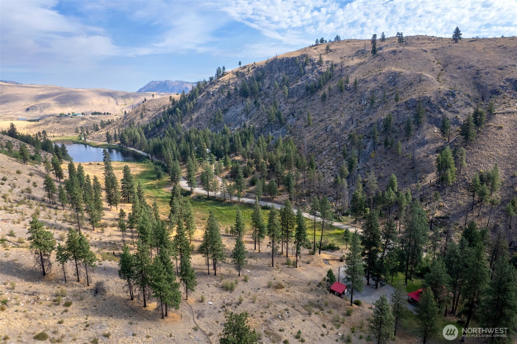 1425 Salmon Creek Road Okanogan, WA 98840 - Photo 6 of 39 a view of a lake in middle of the forest
