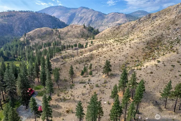 a kitchen with a wooden floor and a table