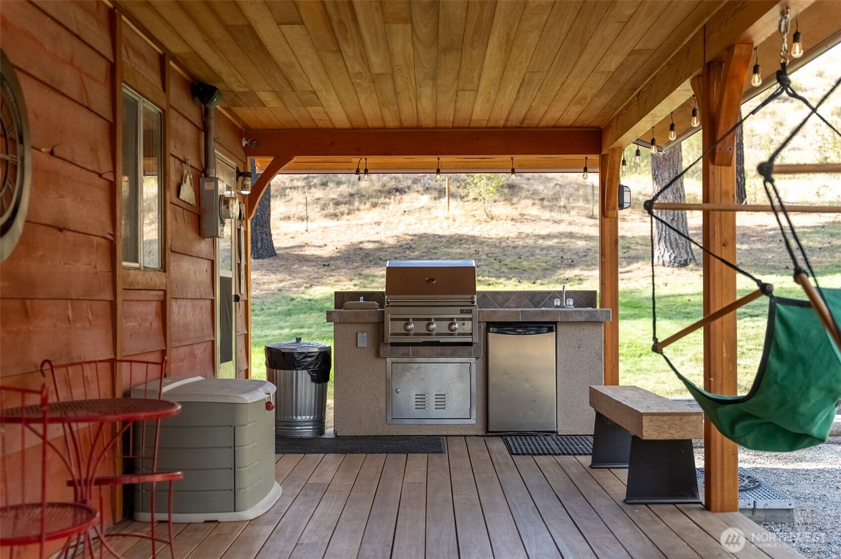 1425 Salmon Creek Road Okanogan, WA 98840 - Photo 10 of 39 a kitchen with a wooden floor and a table