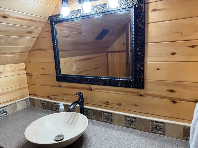 a kitchen with stainless steel appliances kitchen island granite countertop a refrigerator stove and oven