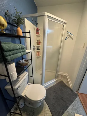 a bedroom with bed and window