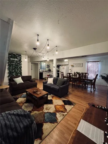 a view of a house with a large tree