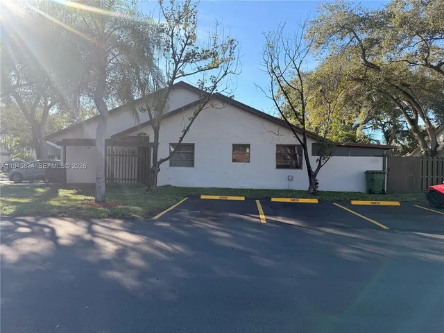a view of backyard with a barn and a cactus plant
