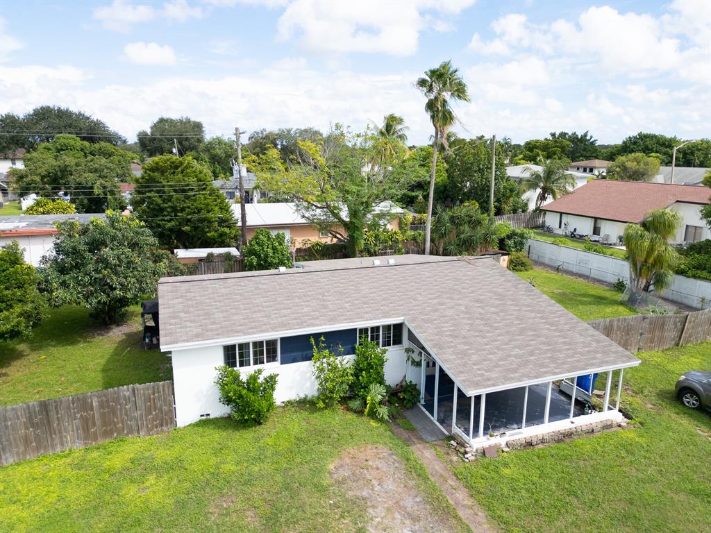 2011 Southwest 97th Terrace Miramar, FL 33025 - Photo 2 of 27 an aerial view of a house with swimming pool and green space