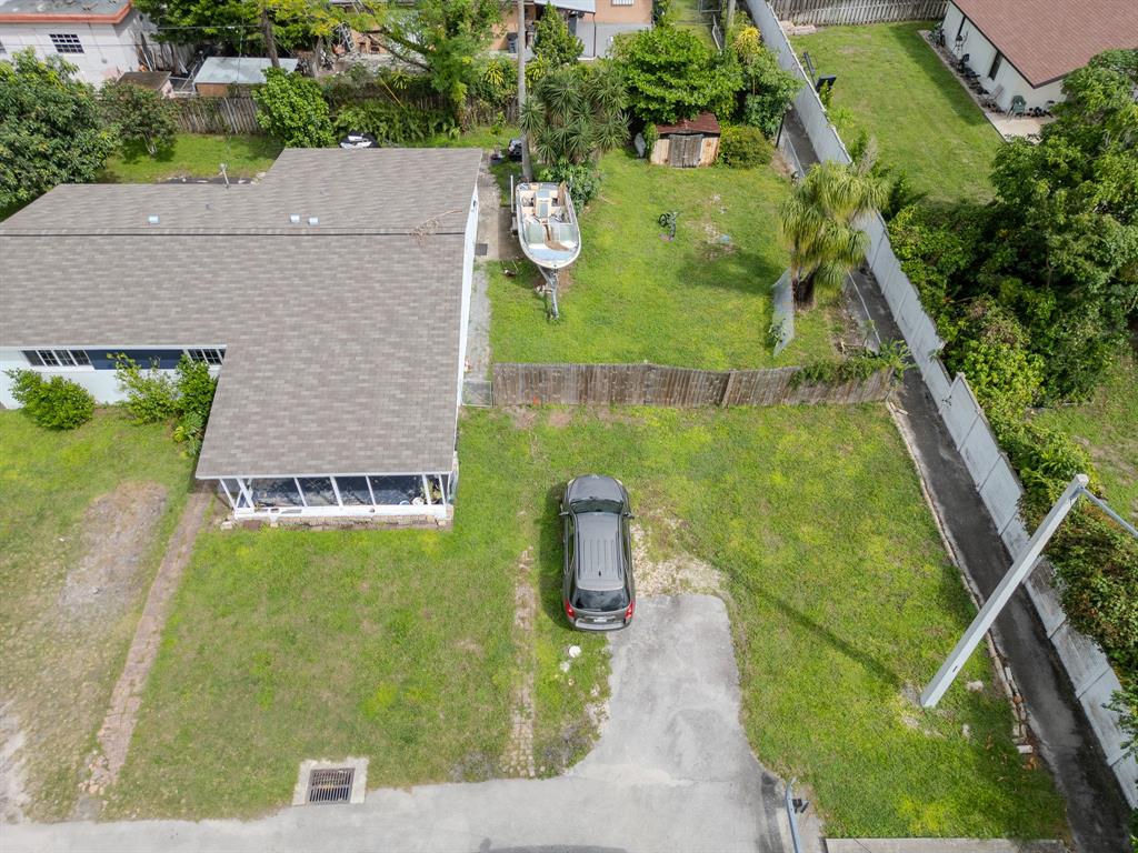 2011 Southwest 97th Terrace Miramar, FL 33025 - Photo 23 of 27 an aerial view of residential house with pool and yard