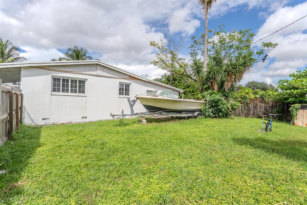 2011 Southwest 97th Terrace Miramar, FL 33025 - Photo 24 of 27 a view of house with backyard and garden
