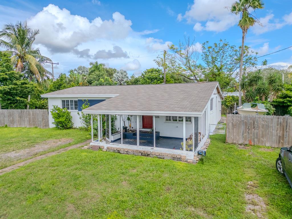 2011 Southwest 97th Terrace Miramar, FL 33025 - Photo 3 of 27 front view of a house with a yard