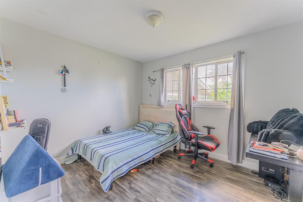 2011 Southwest 97th Terrace Miramar, FL 33025 - Photo 9 of 27 a bedroom with bed and windows