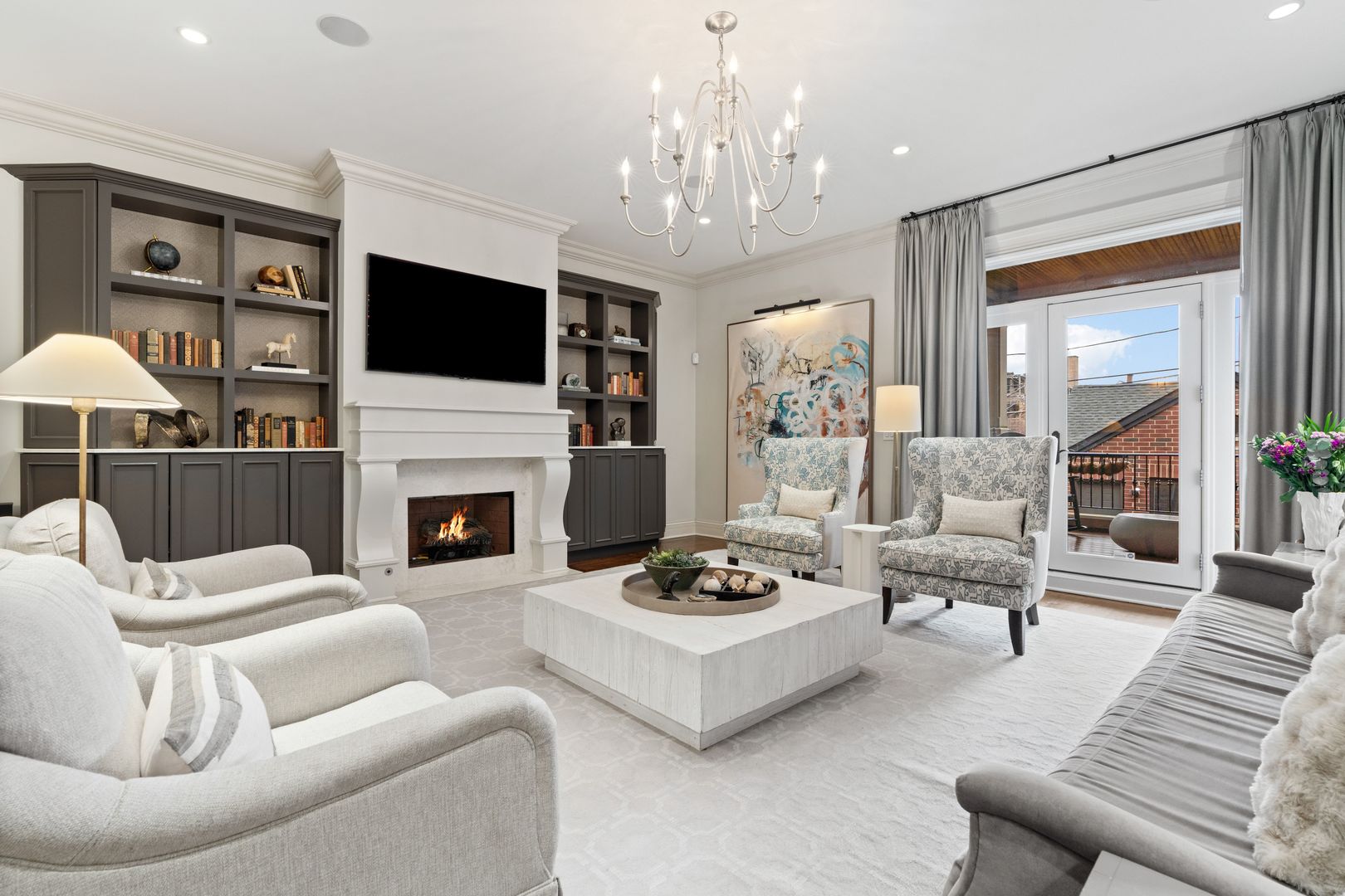 1410 West Byron Street Chicago, IL 60613 - Photo 11 of 40 a living room with furniture a fireplace and a flat screen tv