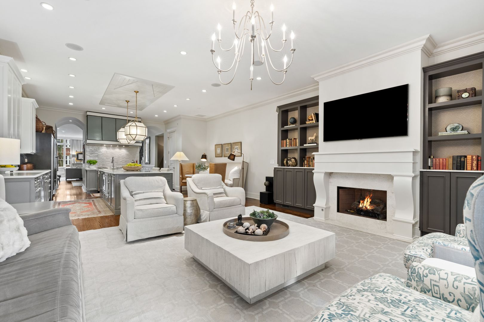 1410 West Byron Street Chicago, IL 60613 - Photo 13 of 40 a living room with furniture a fireplace and a flat screen tv