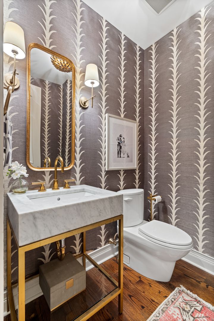 1410 West Byron Street Chicago, IL 60613 - Photo 16 of 40 a bathroom with a sink a toilet and mirror