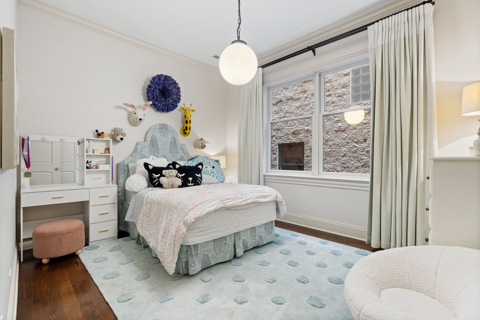 1410 West Byron Street Chicago, IL 60613 - Photo 25 of 40 a bedroom with a bed and a chandelier