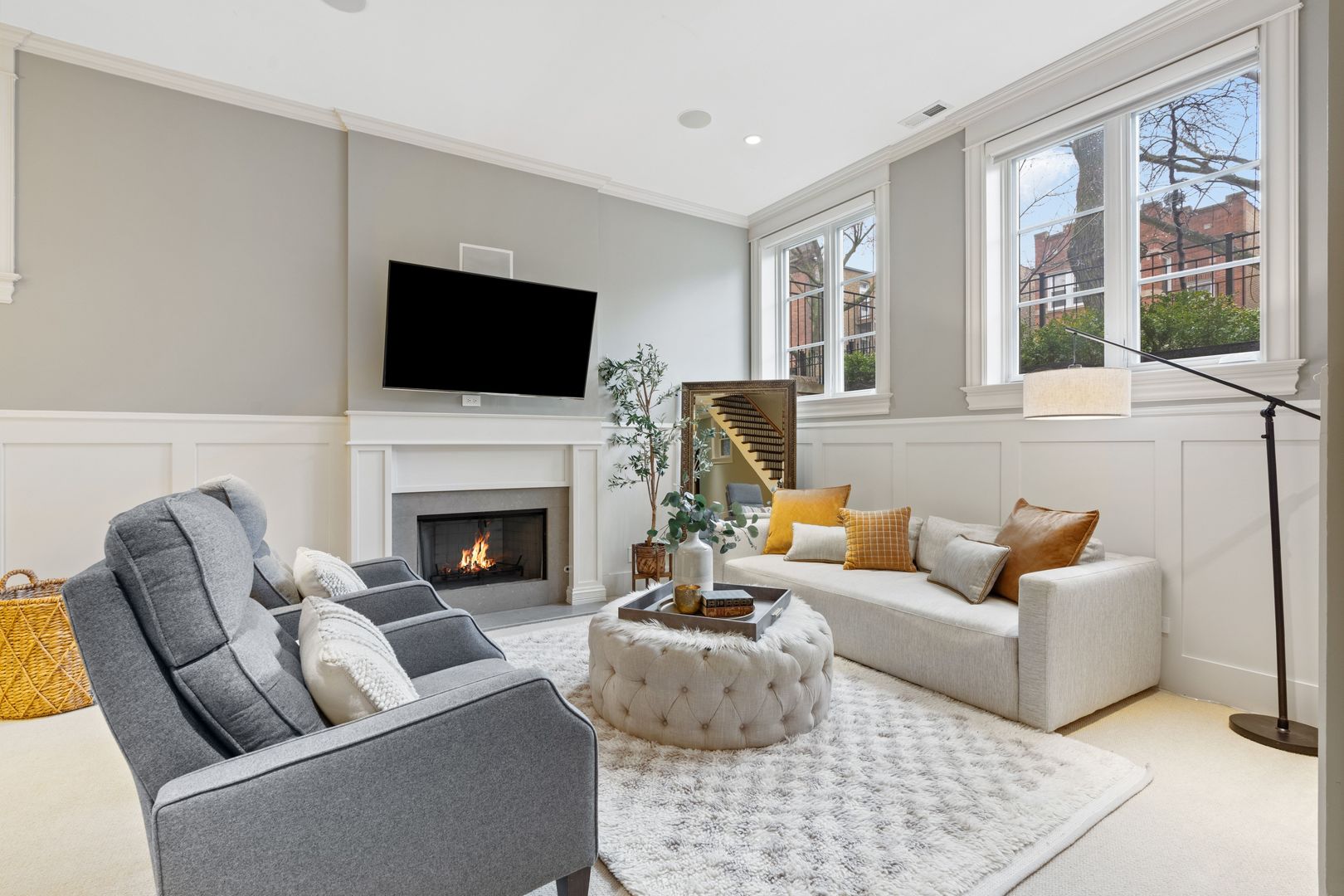 1410 West Byron Street Chicago, IL 60613 - Photo 26 of 40 a living room with furniture a flat screen tv and a fireplace