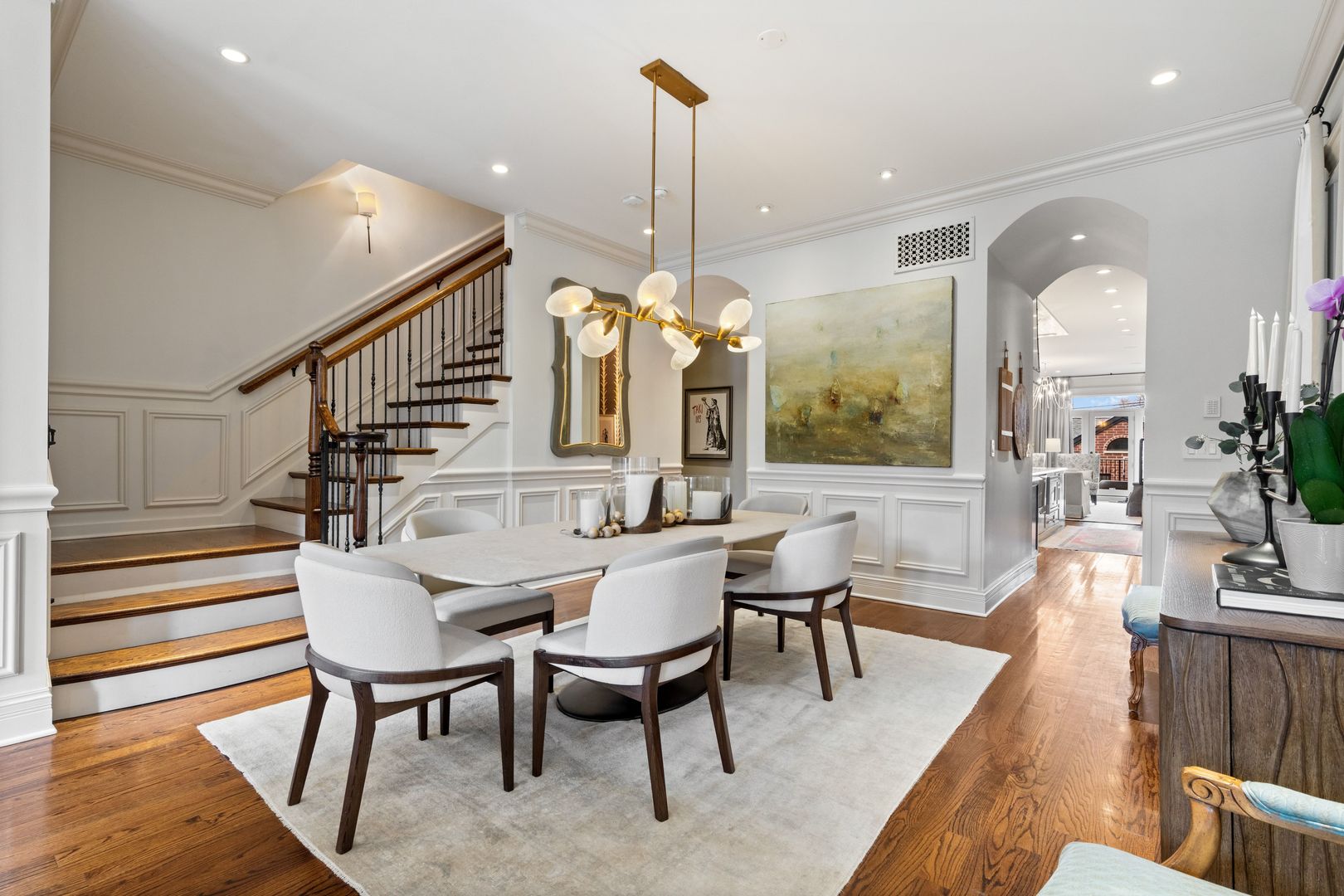 1410 West Byron Street Chicago, IL 60613 - Photo 4 of 40 a dining room with furniture a chandelier and wooden floor