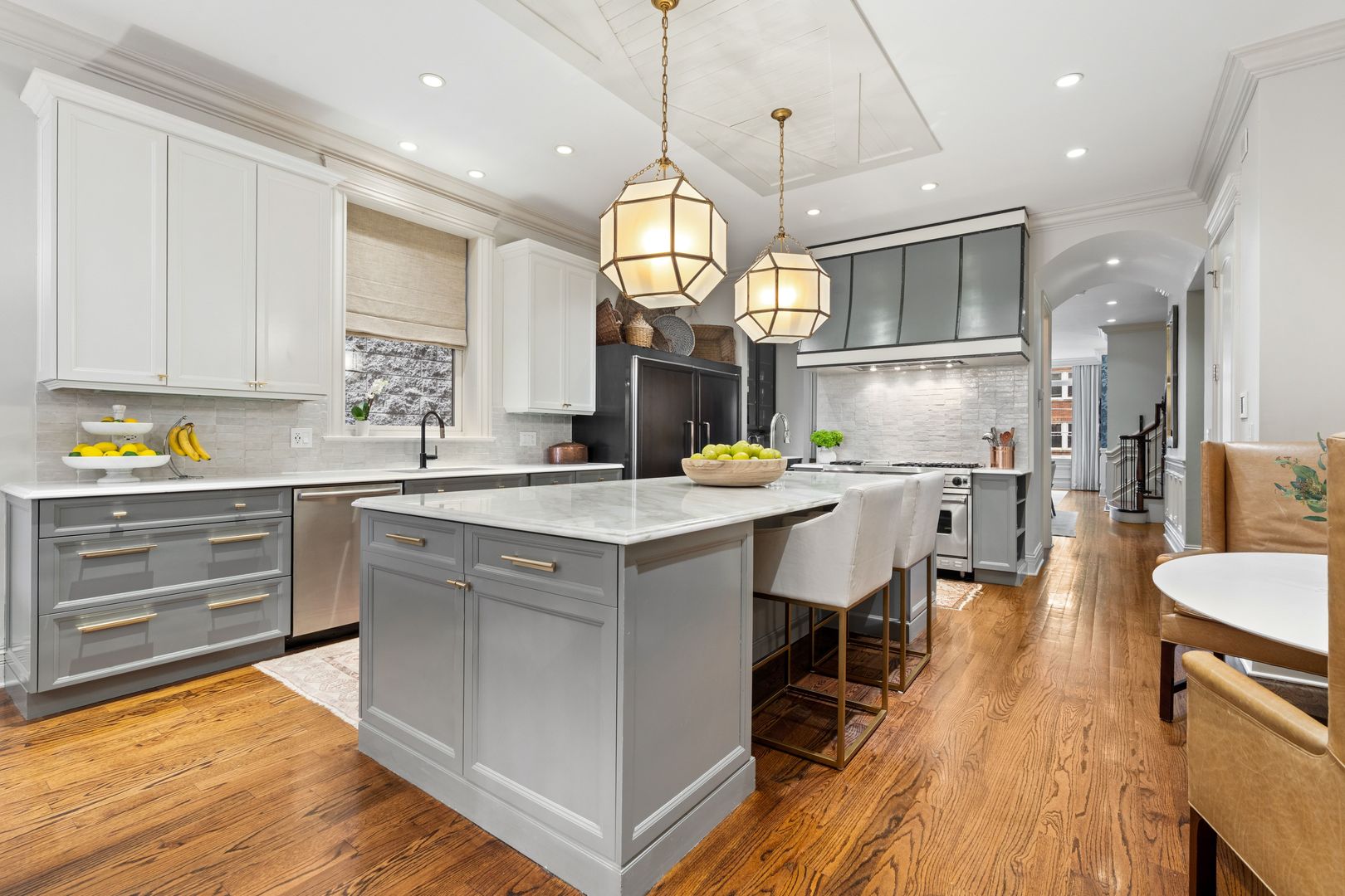 1410 West Byron Street Chicago, IL 60613 - Photo 7 of 40 a kitchen with a sink cabinets and wooden floor