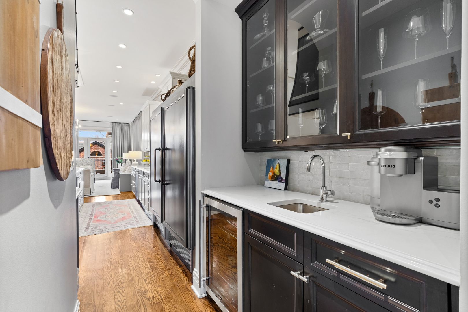 1410 West Byron Street Chicago, IL 60613 - Photo 9 of 40 a kitchen with stainless steel appliances a sink stove and refrigerator