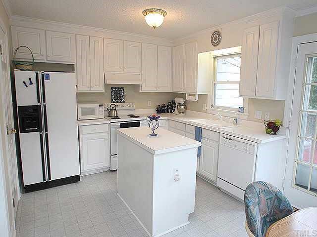 Bright and roomy kitchen with plenty of storage space in it's walk in pantry.