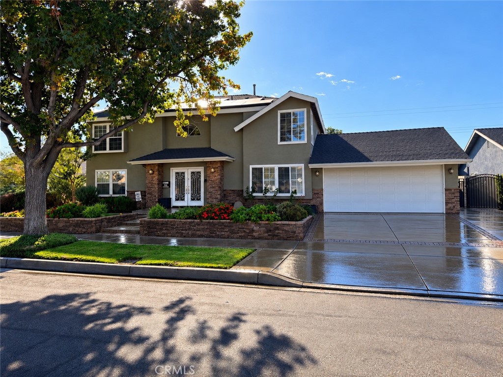 390 North Milford Road Orange, CA 92867 - Photo 1 of 70 Front exterior with beautiful mature trees in a great neighborhood.