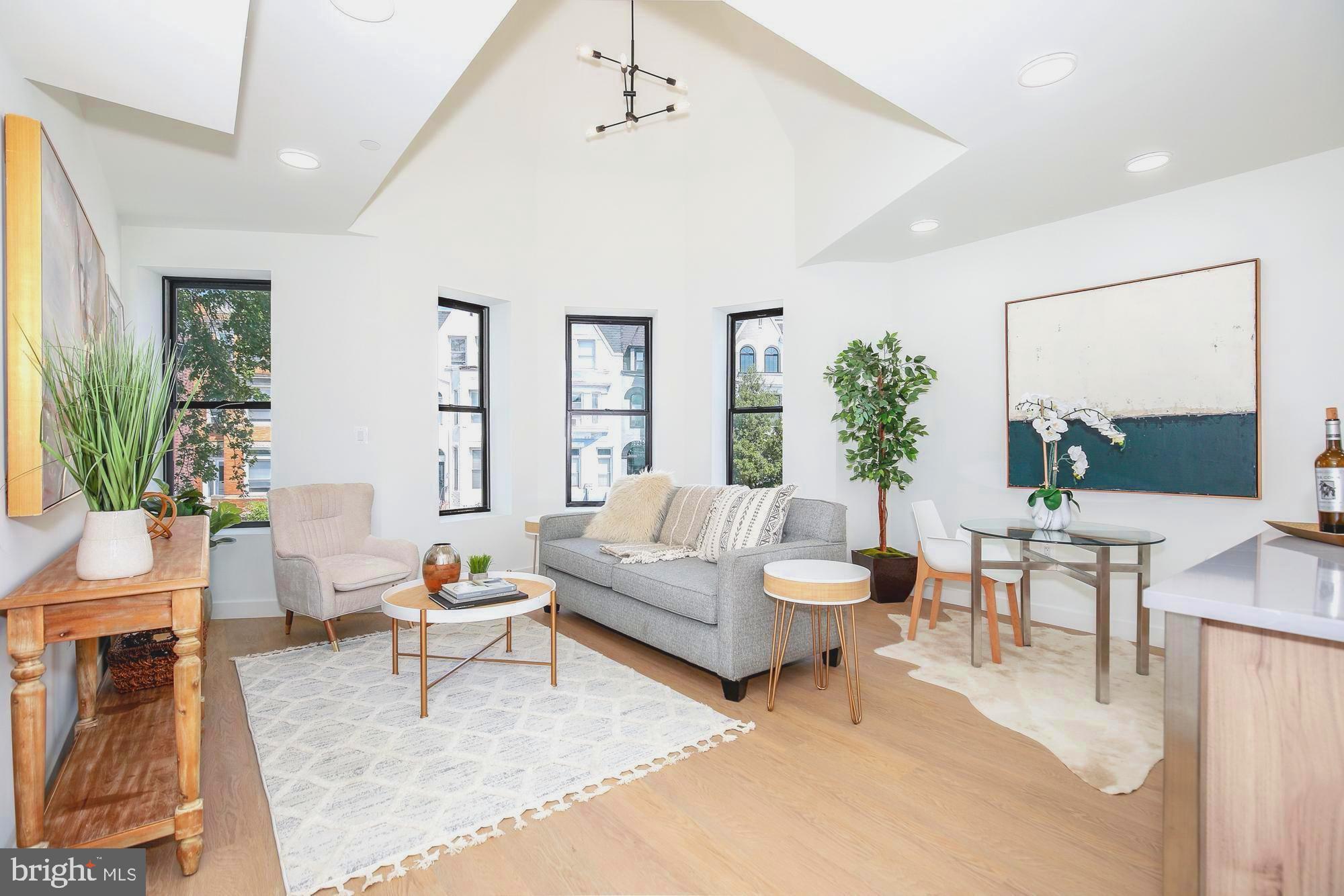 304 Florida Avenue Northwest, Unit 1 Washington, DC 20001 - Photo 1 of 26 a living room with furniture and a large window