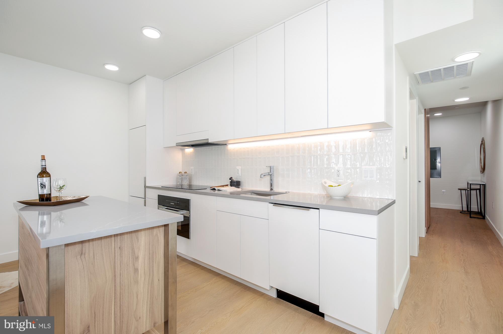 304 Florida Avenue Northwest, Unit 1 Washington, DC 20001 - Photo 11 of 26 a kitchen with sink a stove and cabinets
