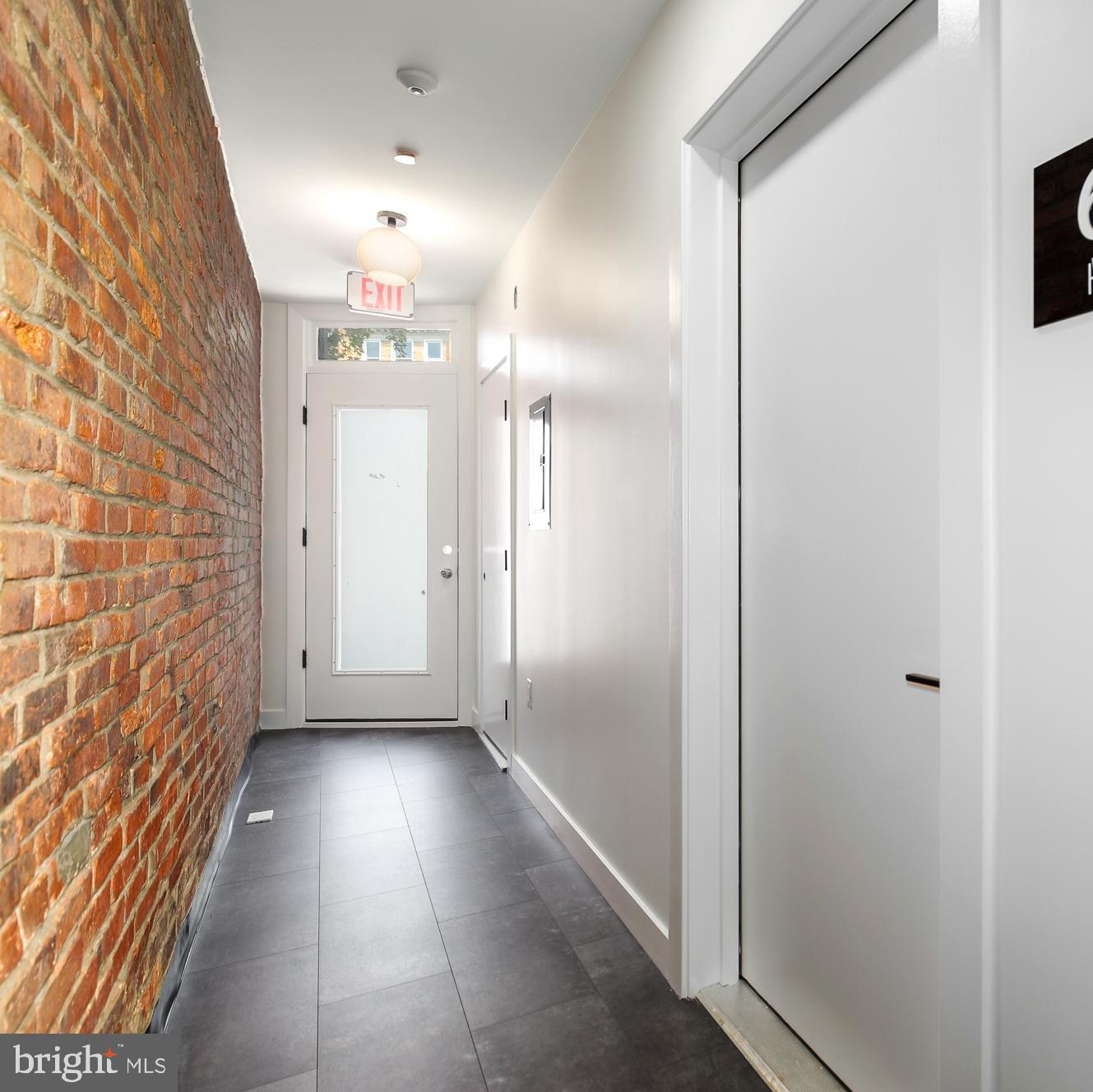 304 Florida Avenue Northwest, Unit 1 Washington, DC 20001 - Photo 19 of 26 a view of a hallway with wooden floor and staircase