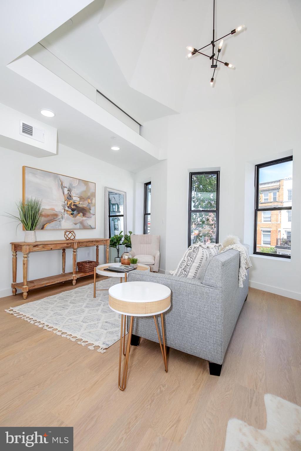 304 Florida Avenue Northwest, Unit 1 Washington, DC 20001 - Photo 2 of 26 a living room with furniture and a window
