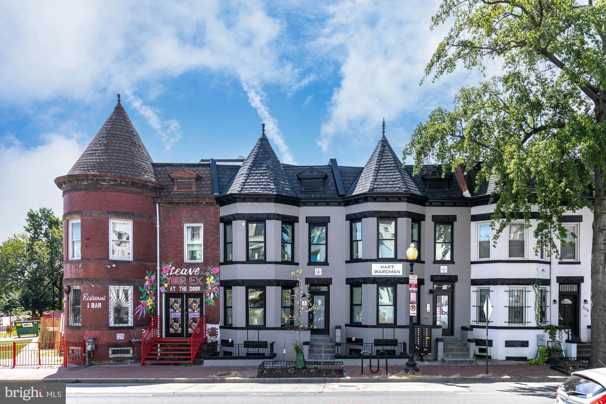 304 Florida Avenue Northwest, Unit 1 Washington, DC 20001 - Photo 22 of 26 a front view of a residential apartment building with a yard