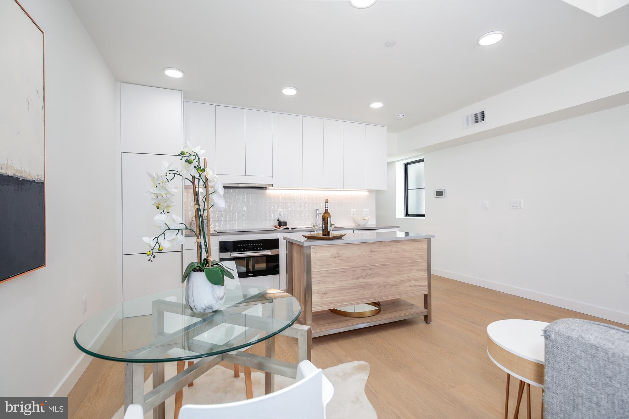 304 Florida Avenue Northwest, Unit 1 Washington, DC 20001 - Photo 7 of 26 a room with a table and chairs in it