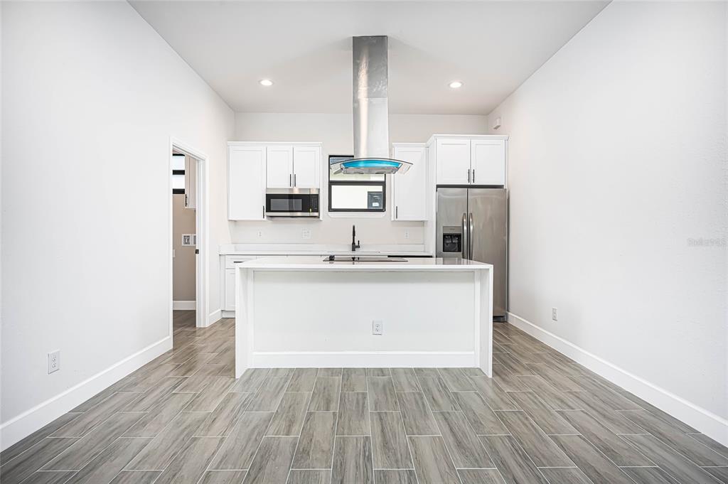 183 Sesame Road East Rotonda West, FL 33947 - Photo 11 of 59 a view of kitchen with wooden floor